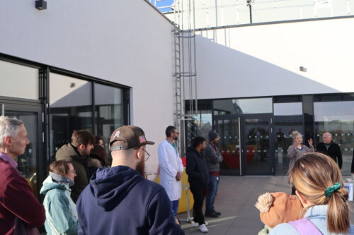 Participants of the opening ceremony listening to a speech