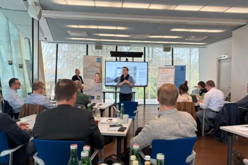 two women presenting in front of an audience